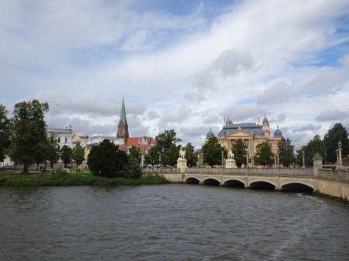 Free A beautiful view of Schwerin Castle over a river and bridge in Germany. Stock Photo
