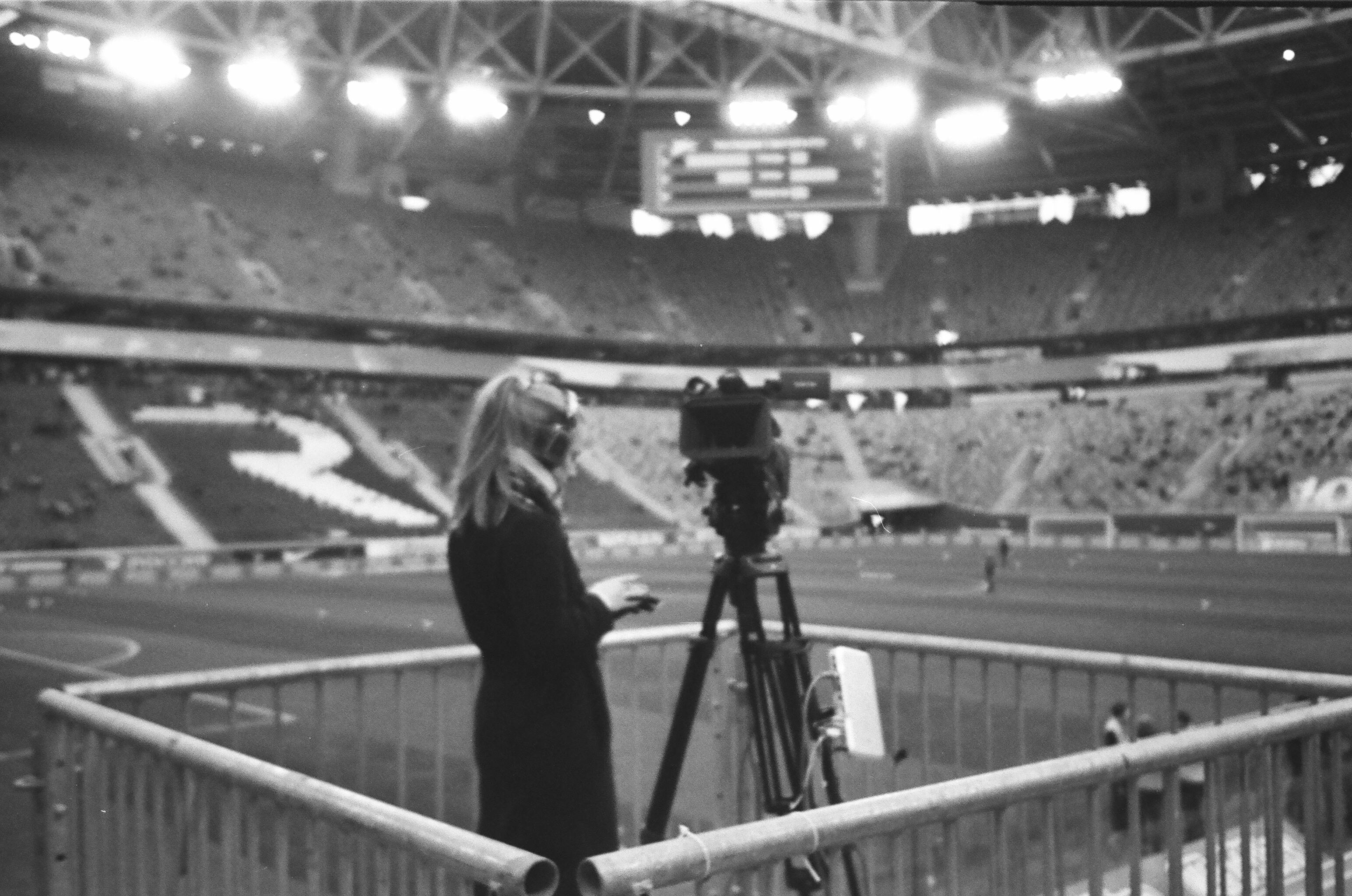 female camera operator working at stadium