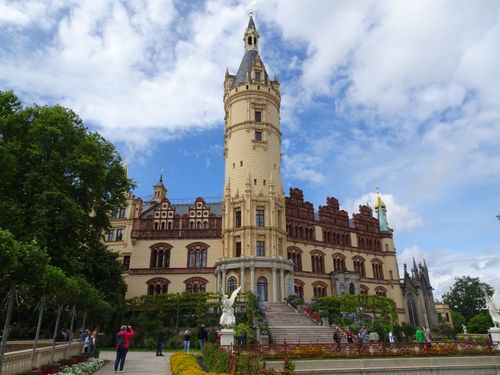 Free View of Schwerin Castle in Mecklenburg-Vorpommern, Germany with lush gardens. Stock Photo