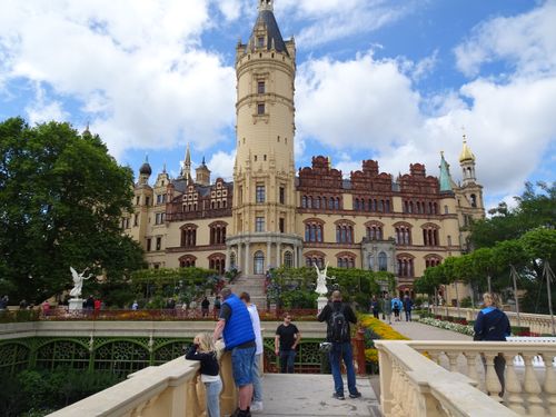 Free Stunning view of Schwerin Castle with tourists enjoying the vibrant summer day. Stock Photo
