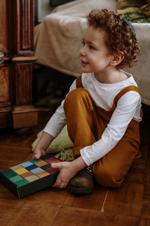 Free Boy Sitting on the Floor Stock Photo