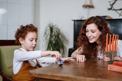 Boy Playing With Dreidel