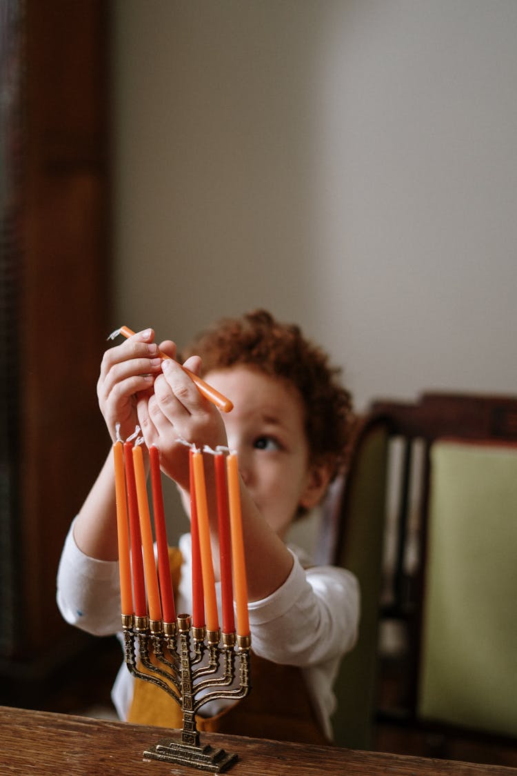 Child Holding A Candle