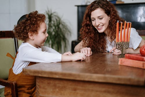 Mother and Son With a Menorah