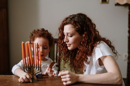Mother and Son With a Menorah
