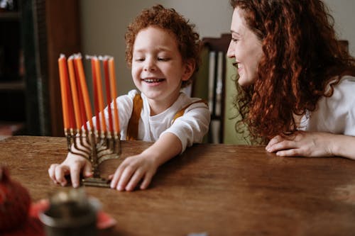 Mother and Son With a Menorah