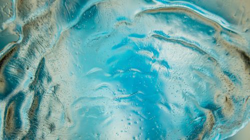 Free Close-up view of a captivating abstract blue ice texture. Perfect for backgrounds or wallpapers. Stock Photo