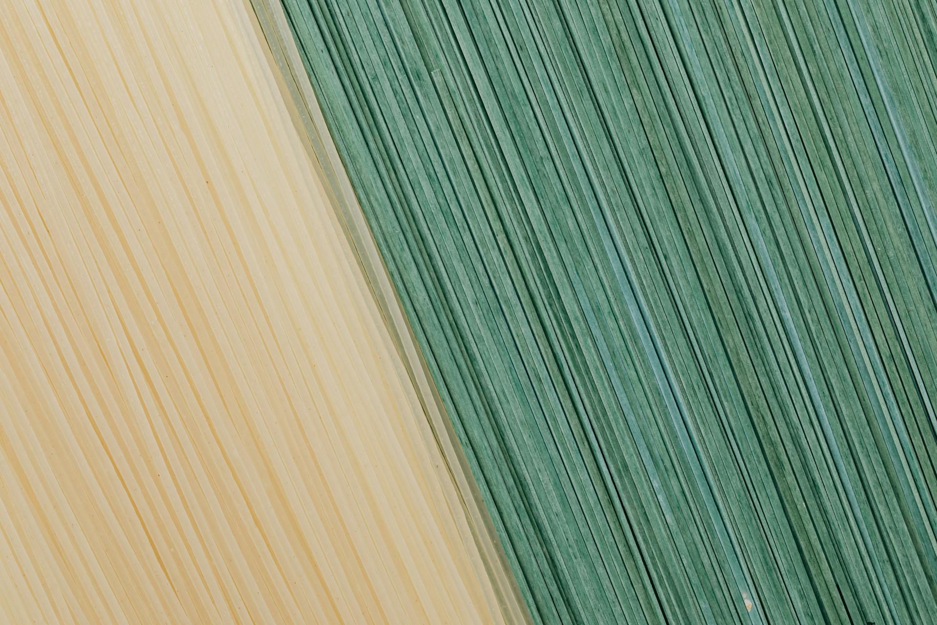 Yellow and green food background from dry pasta