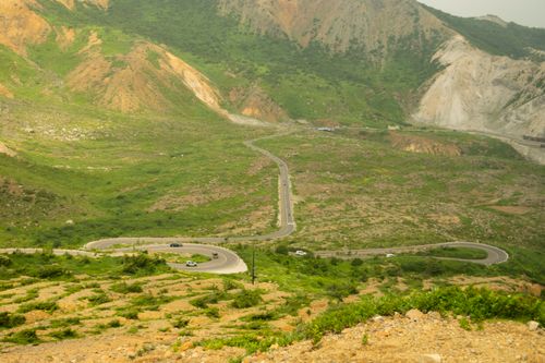 Free A winding mountainous road through lush landscapes in Fukushima, Japan. Stock Photo