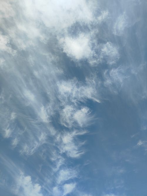 Free A serene sky with wispy cirrus clouds creating a calming and airy atmosphere. Stock Photo