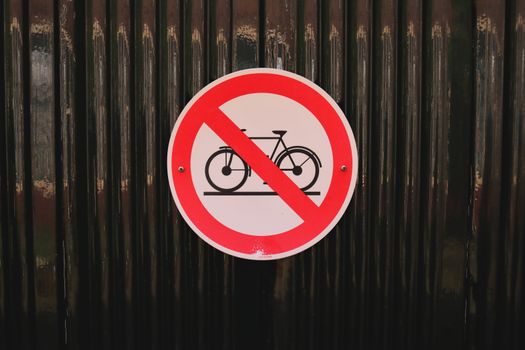 No bicycles allowed sign mounted on textured metal in Haarlem, Netherlands.