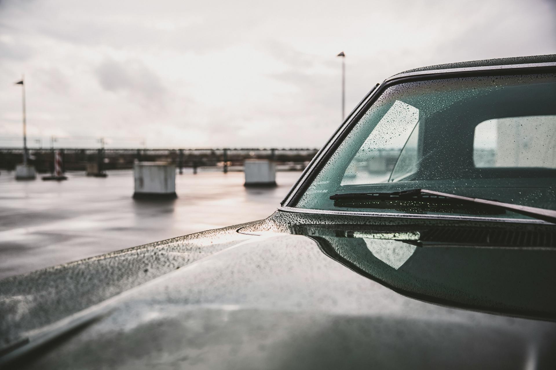 Wet Black Car on Road