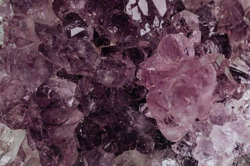 Free Detailed close-up of amethyst crystals showcasing their rich textures and deep colors. Stock Photo