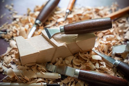 Free Detailed shot of woodworking tools and wood shavings, perfect for craft and DIY projects. Stock Photo