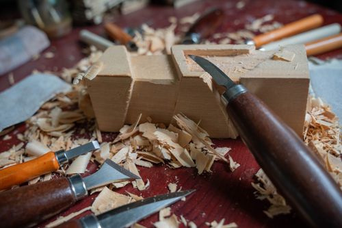 Free Close-up of wood carving tools and shavings suggesting craftsmanship and skill. Stock Photo