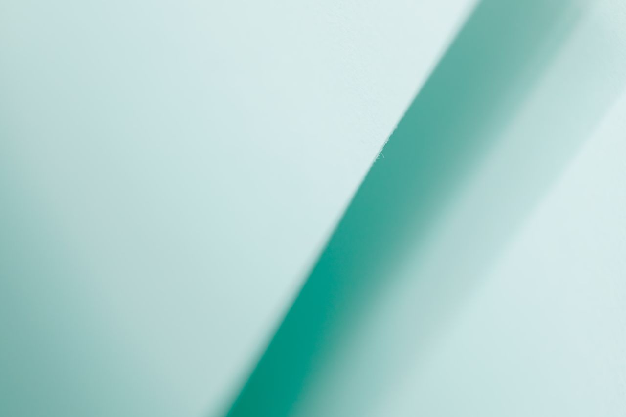 textured backdrop of diagonal lines of turquoise gradient color with p