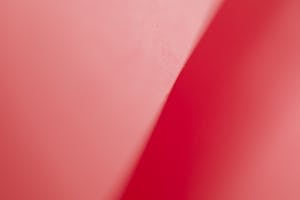 Textured background with diagonal line in middle of peachy carton