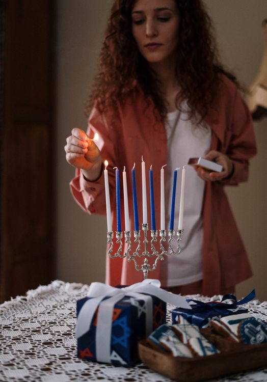 Free Woman Lighting up Candles Stock Photo