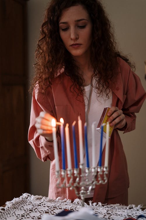 Woman Lighting up Candles