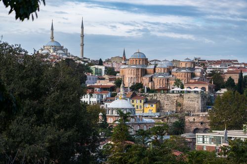 Free Panoramic view of Istanbul featuring historical mosques and unique architecture under a partly cloudy sky. Stock Photo