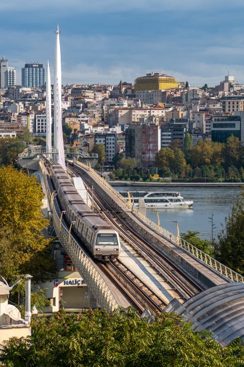 Free Train crossing Haliç Metro Bridge over Golden Horn in Istanbul on a sunny day. Stock Photo