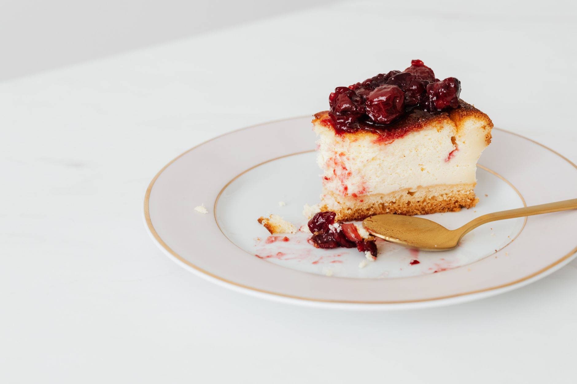 Vegan cheesecake topped with fresh cranberry sauce ready for Christmas