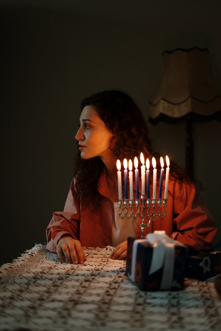 Woman Sitting With Candles