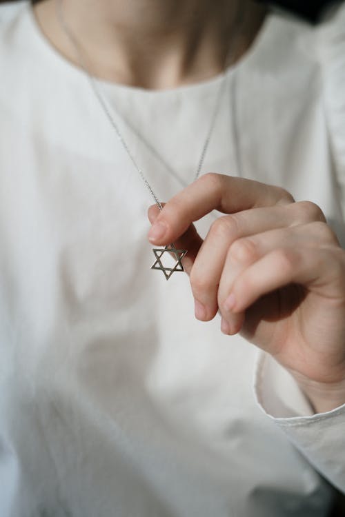 Free Person Holding a Star of David Stock Photo