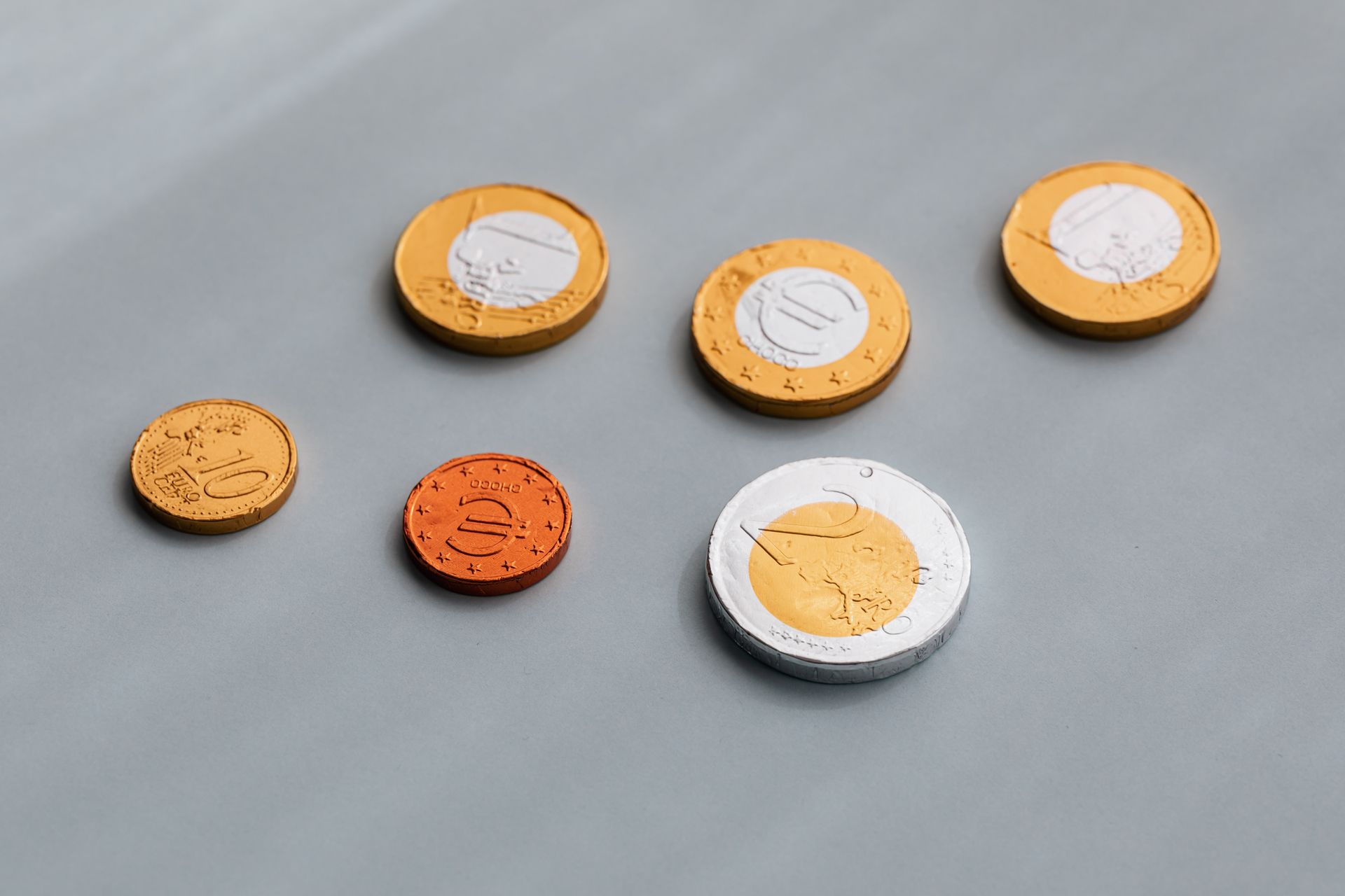 From above of various coins of European Union in circulation arrangement on gray table