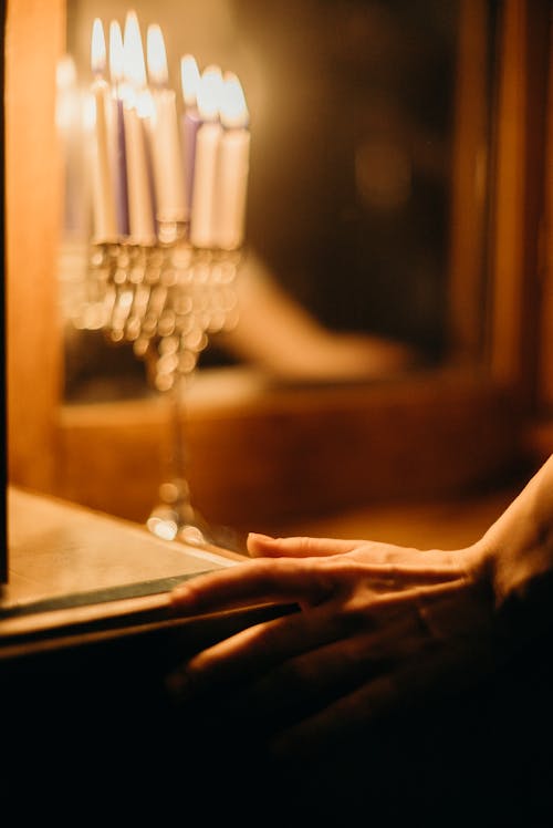 Hand Close to Candles