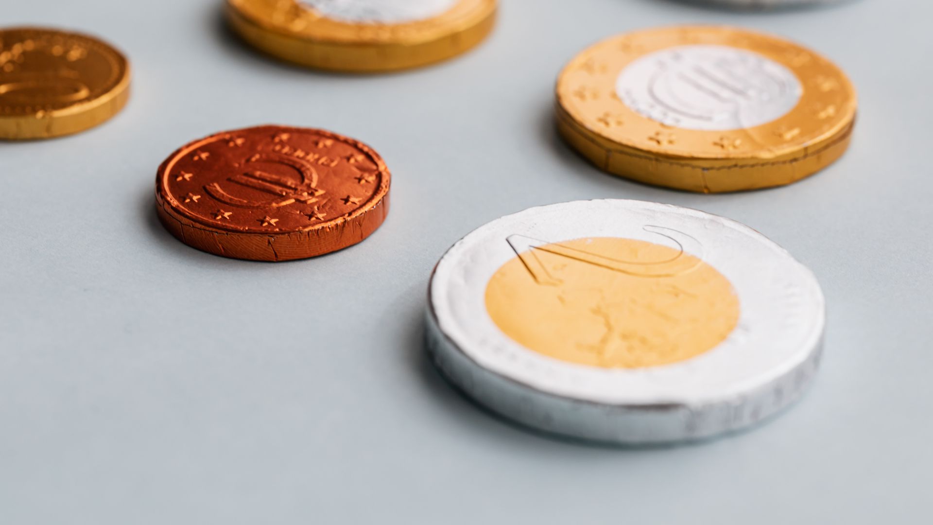 How Does Maximising Benefits Work: A Comprehensive Guide From above closeup of different size chocolate coins in foil package placed on white background — how does maximising benefits work