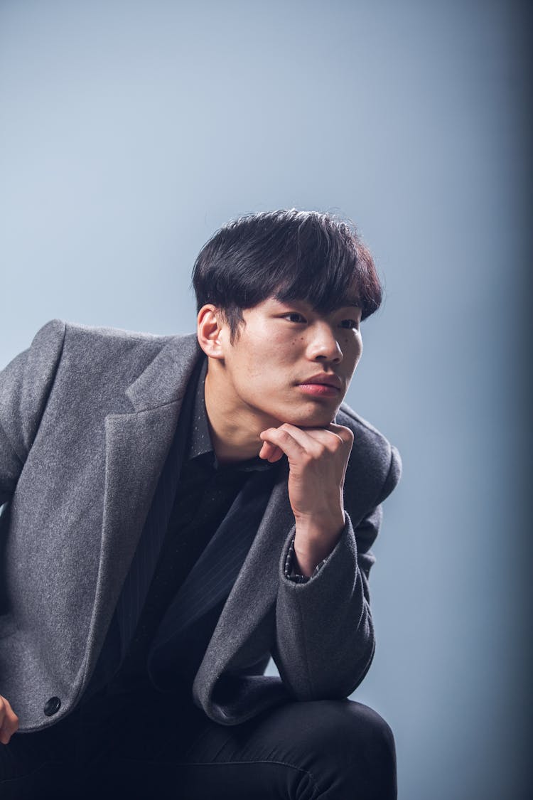 Elegant Pensive Man In Studio