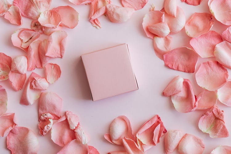 Pink Gift Box Among Rose Petals