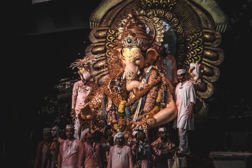 Free A vibrant Ganesh idol procession during Ganesh Visarjan in Mumbai, India, showcasing cultural richness. Stock Photo