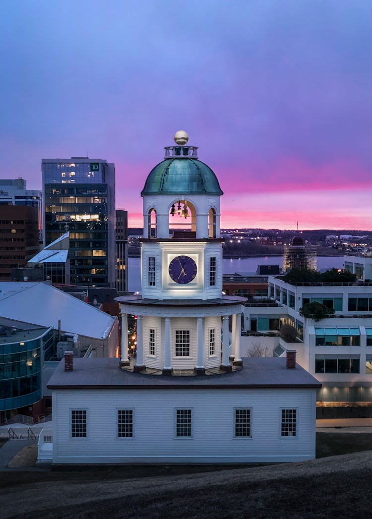 Old Landmark With Clock Under Colorful Sky