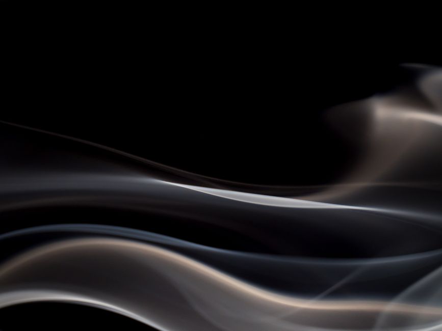 Smooth abstract smoke pattern with a dynamic flow against a dark backdrop, creating a modern and visual appeal.