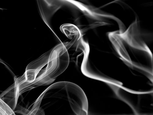 Free Captivating black and white abstract image of swirling smoke patterns against a dark backdrop. Stock Photo