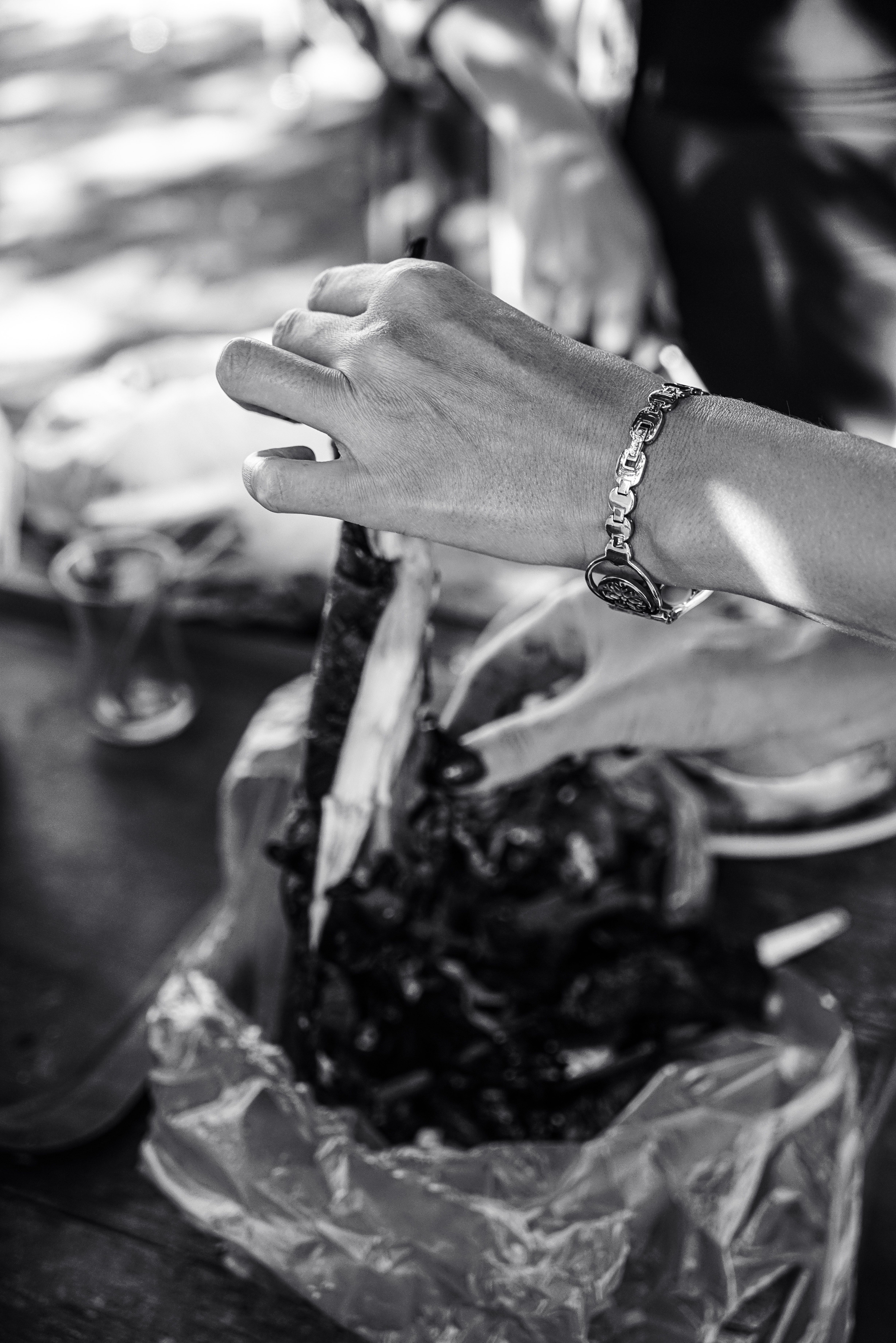 Black and White Culinary Scene with Hands · Free Stock Photo