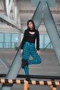 Young woman in trendy clothes on parking