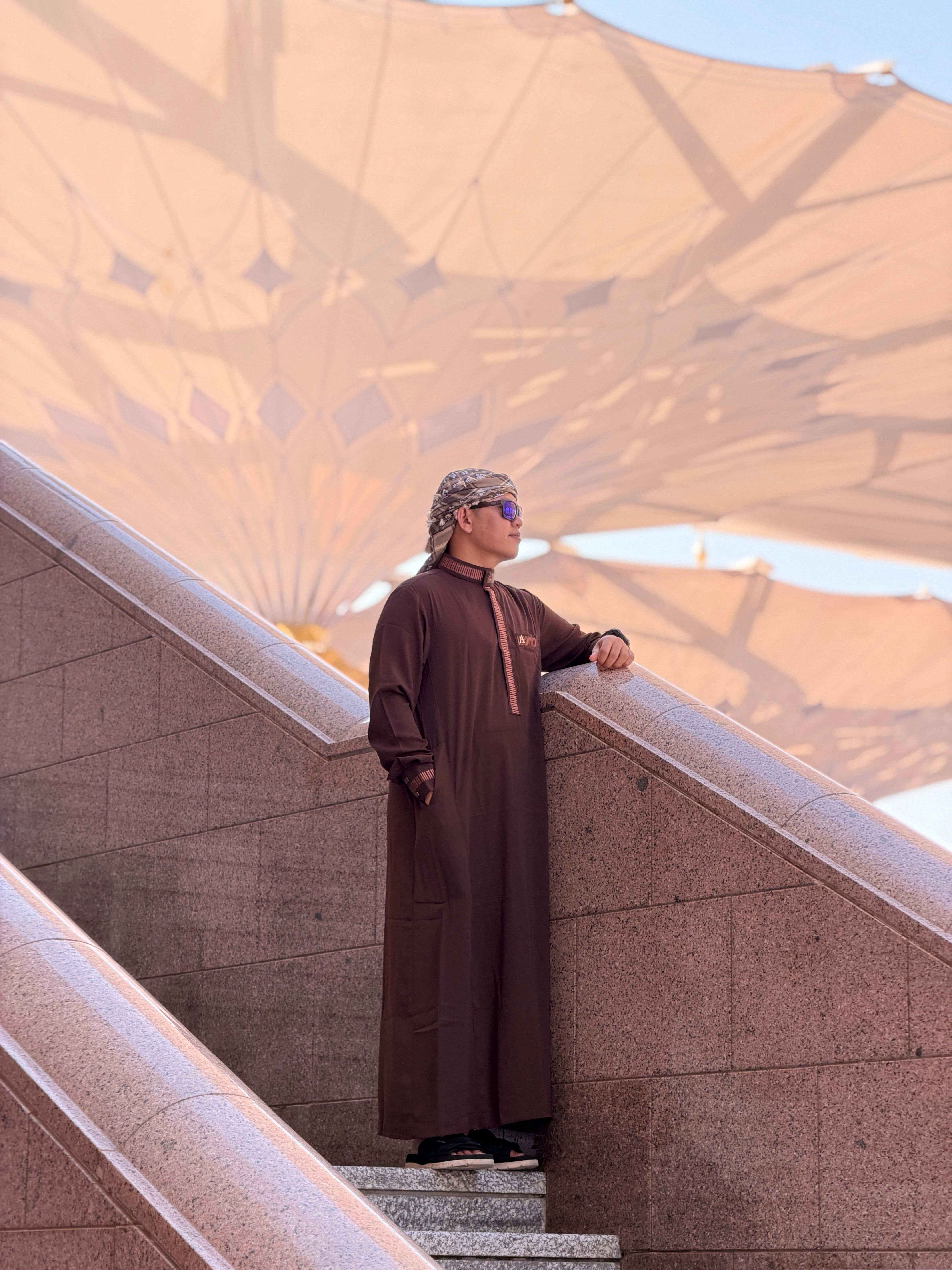 Man in Traditional Attire at Madinah Mosque · Free Stock Photo