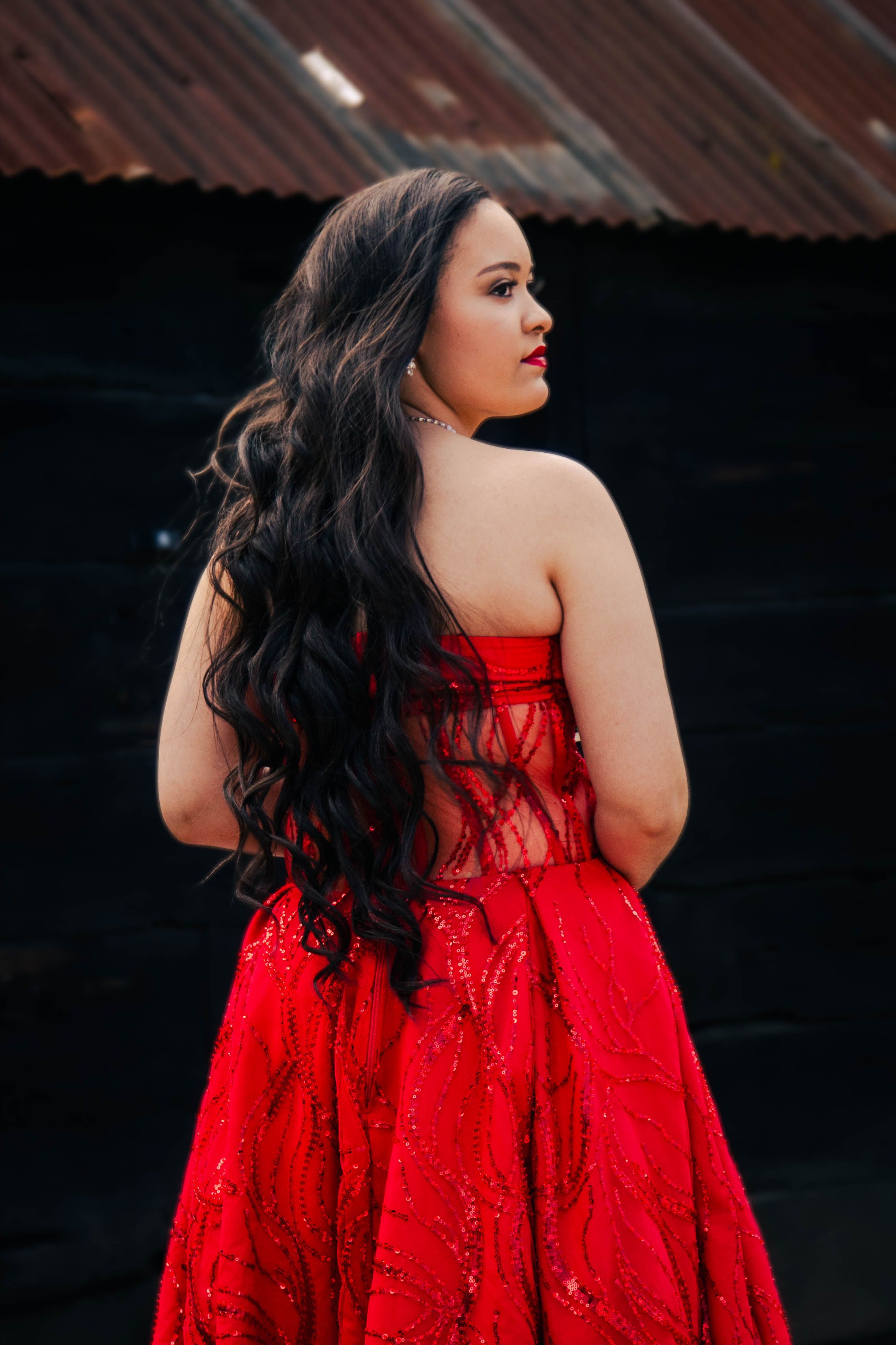 Elegant Woman in Red Gown Posing Outdoors · Free Stock Photo