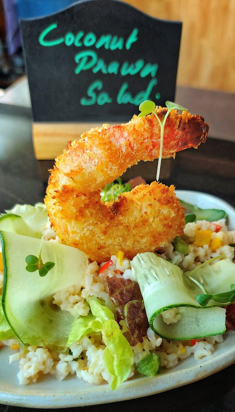 Salad With Fried Shrimp In Cafe