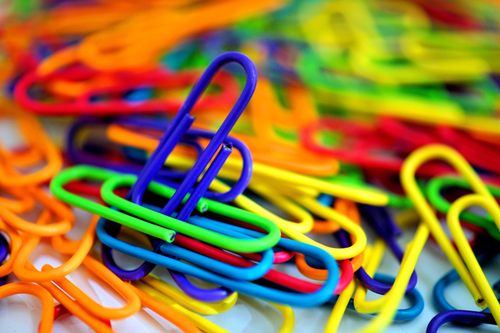 Free Colorful plastic paperclips in a close-up with a vibrant, multicolored arrangement. Stock Photo