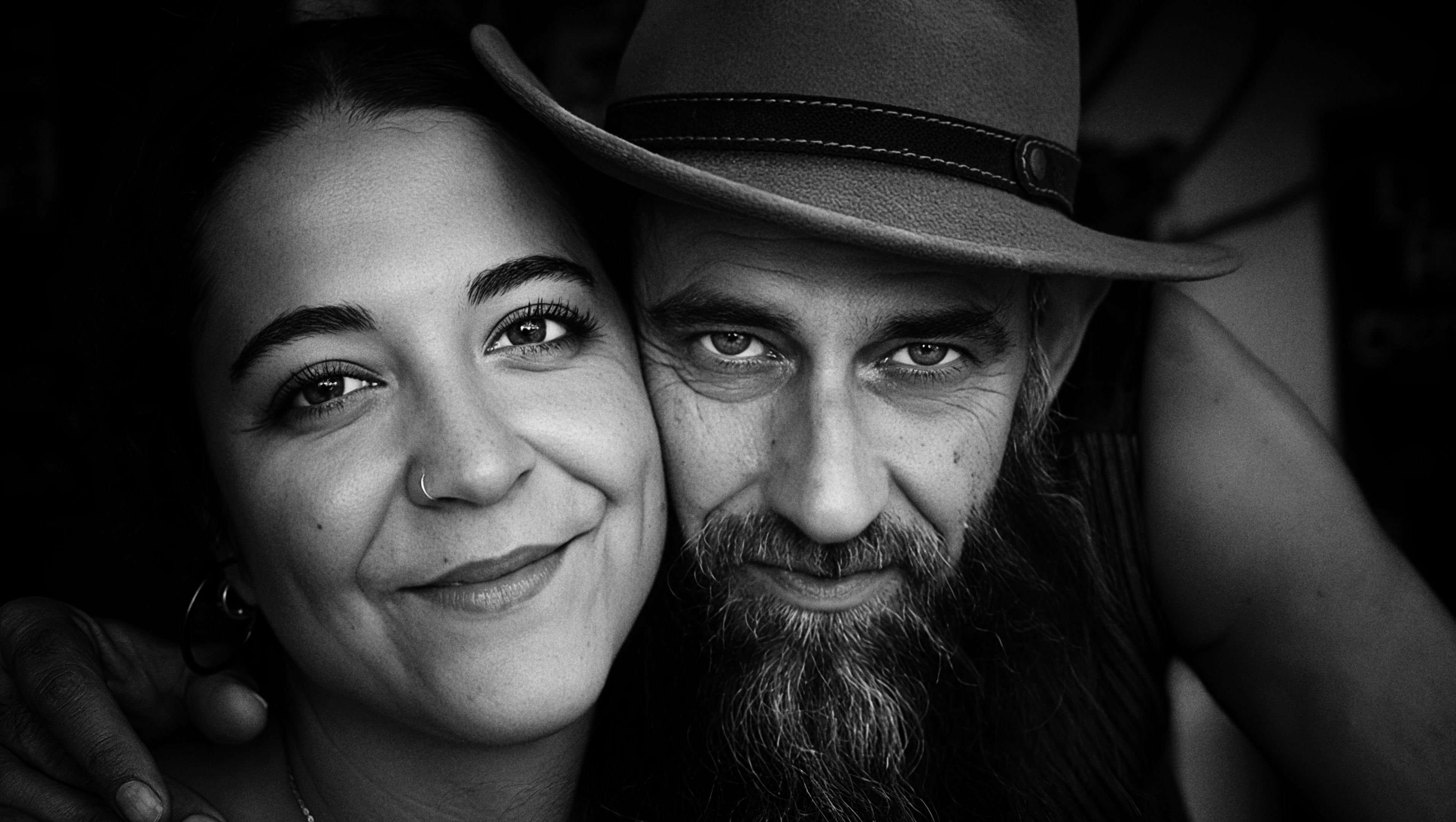 Close-Up Portrait of a Smiling Couple · Free Stock Photo