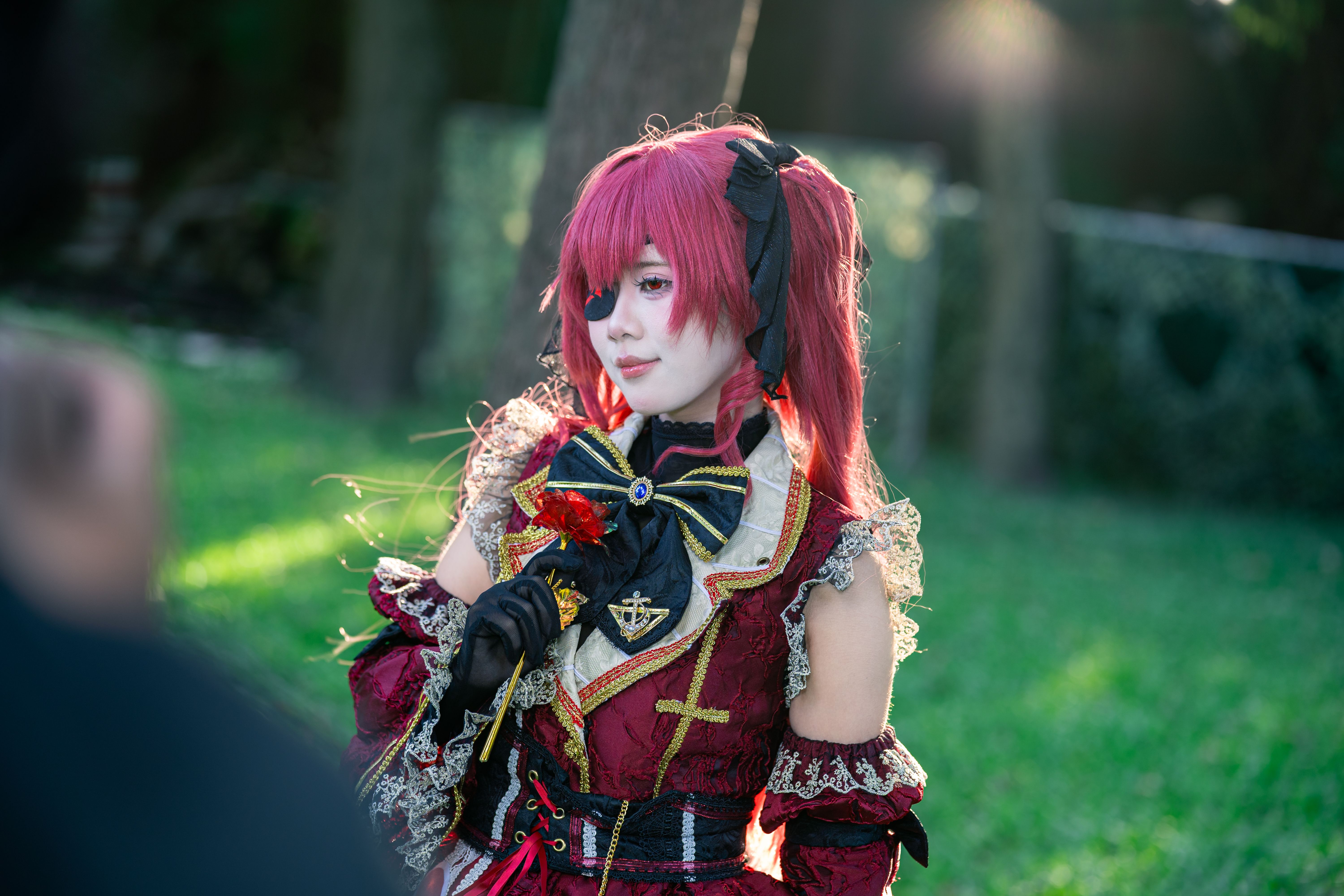 Cosplay Character in Gothic Lolita Costume Outdoors · Free Stock Photo