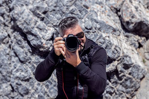 Free Man Wearing a Jacket Taking a Picture Stock Photo