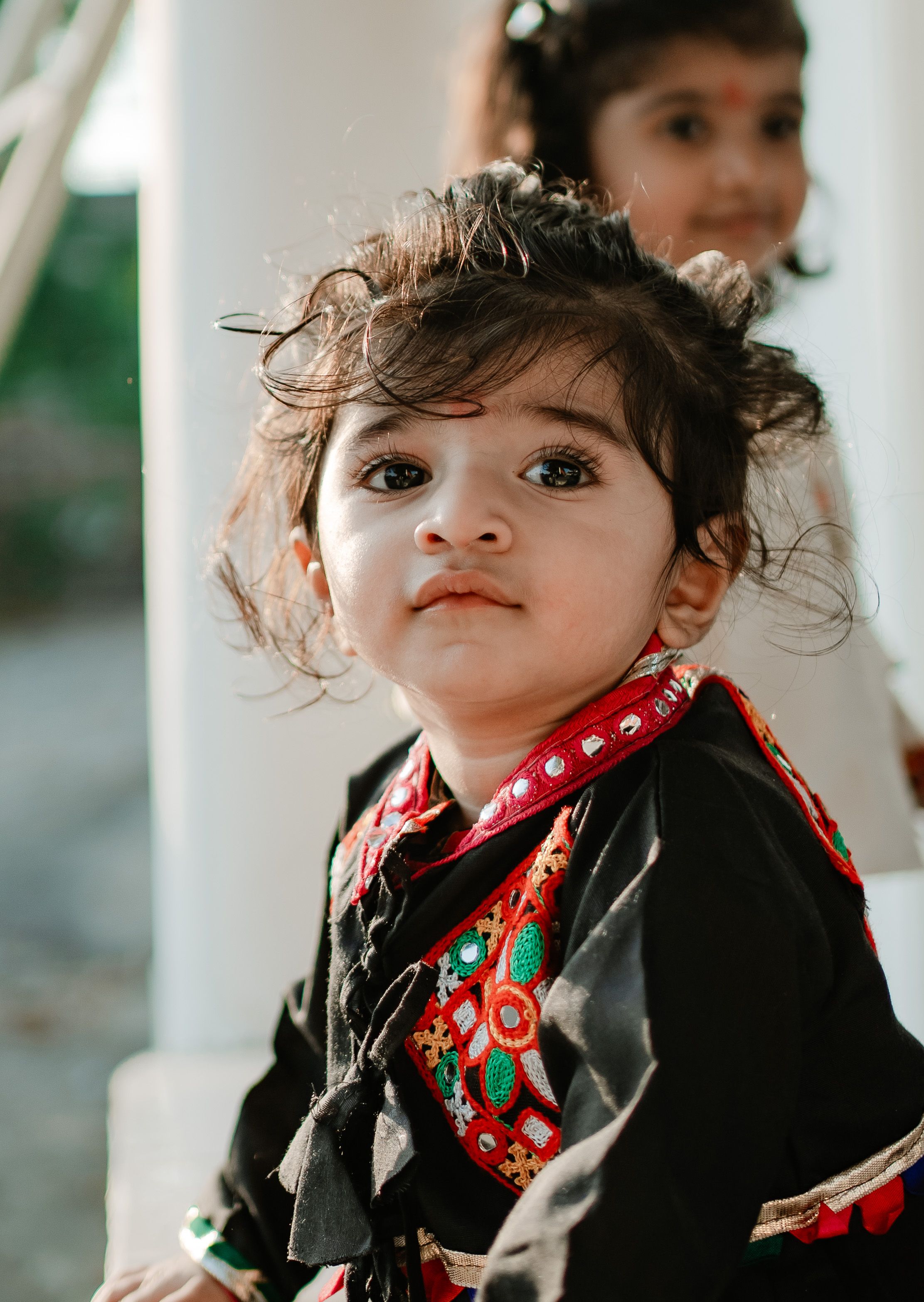 Charming Portrait of Young Child in Traditional Attire · Free Stock Photo