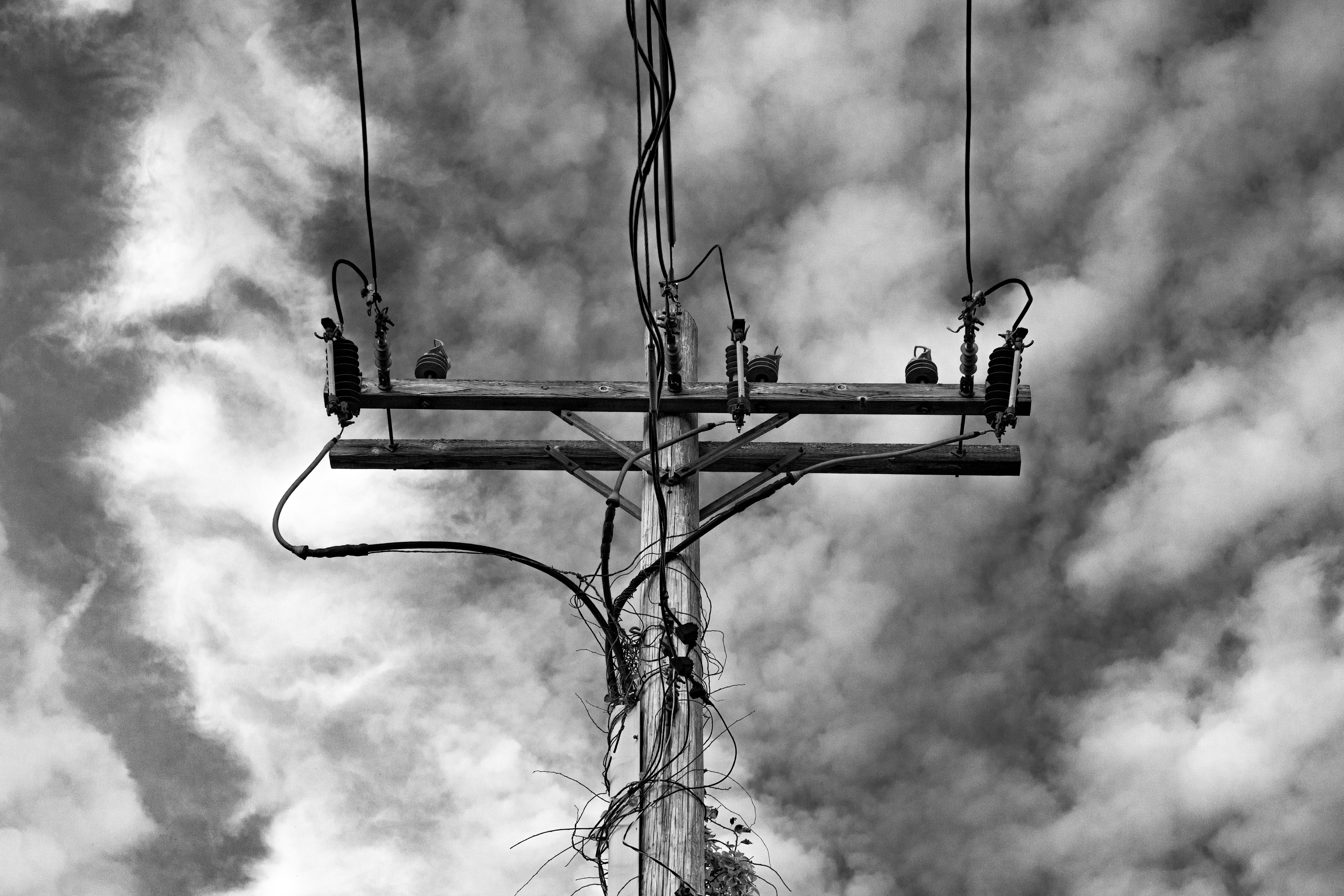 Monochrome Power Line Against Cloudy Sky · Free Stock Photo