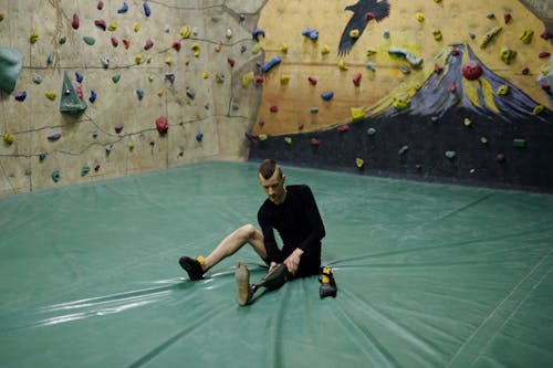 Man Adjusting Prosthetic Leg