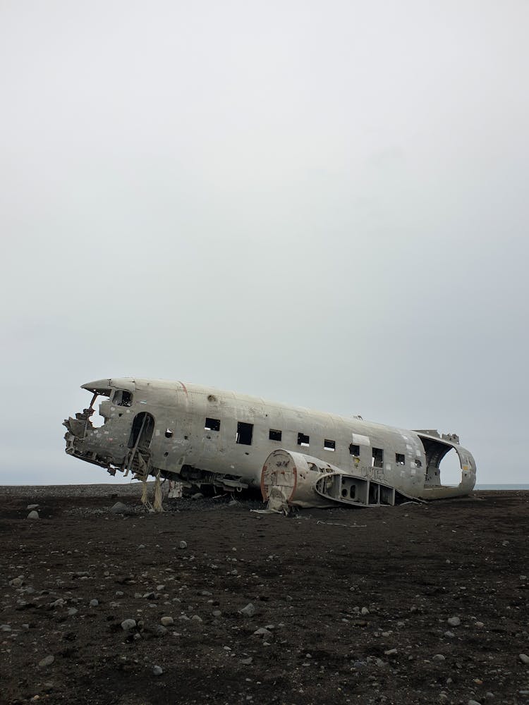 Airplane Wreckage On Dirt Ground